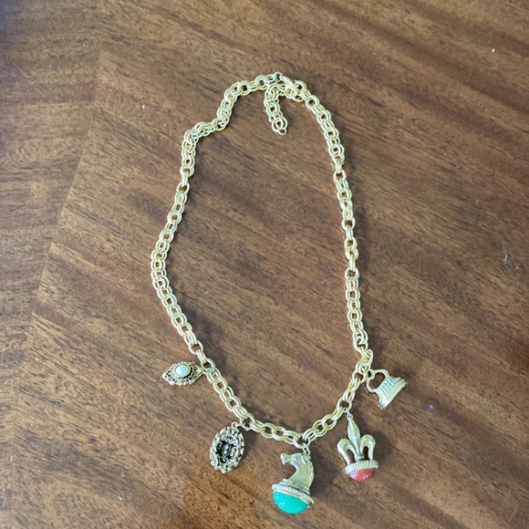 Gold tone charm necklace. Adjustable length. Great condition. - Picture 8 of 10